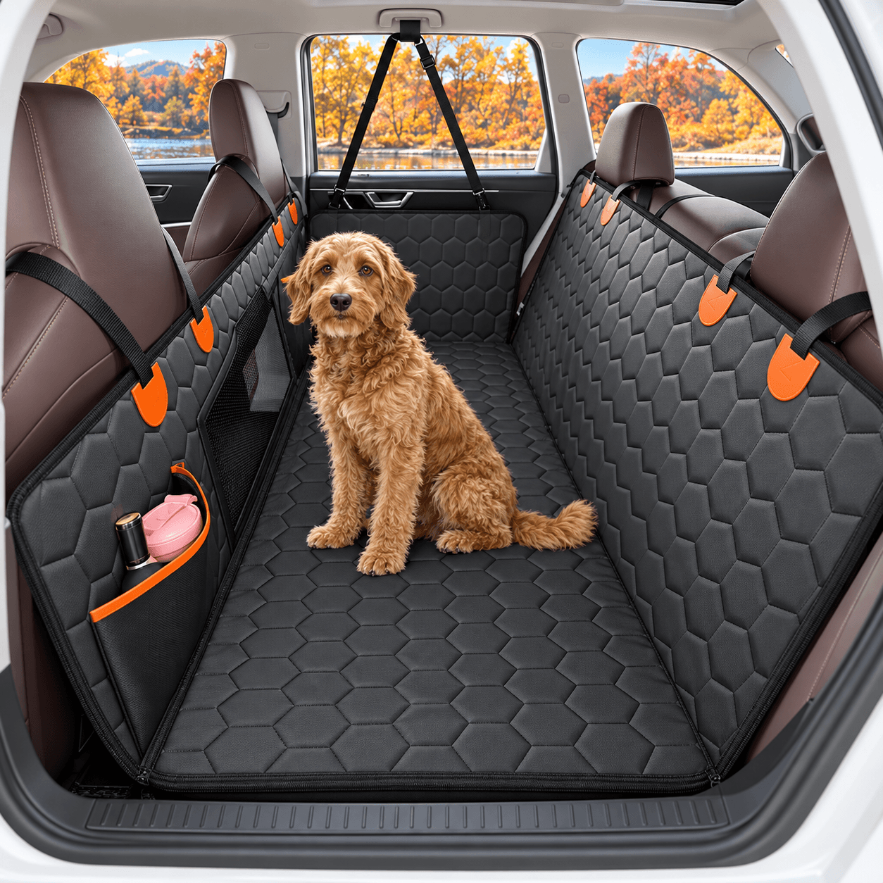 Hard-bottom rear-seat extender installed across a premium SUV rear bench with a dog